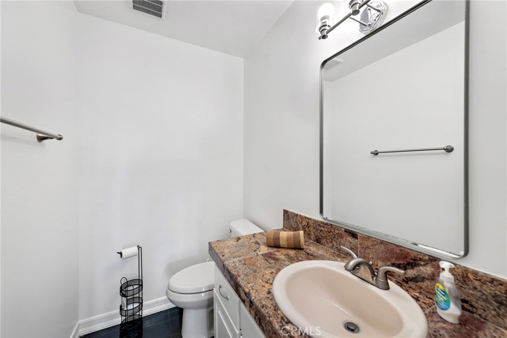 1707 West Balboa Boulevard, Unit A Newport Beach, CA 92663 - Photo 15 of 30 a bathroom with a sink and a toilet
