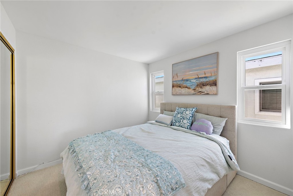1707 West Balboa Boulevard, Unit A Newport Beach, CA 92663 - Photo 16 of 30 a bedroom with a bed and a window