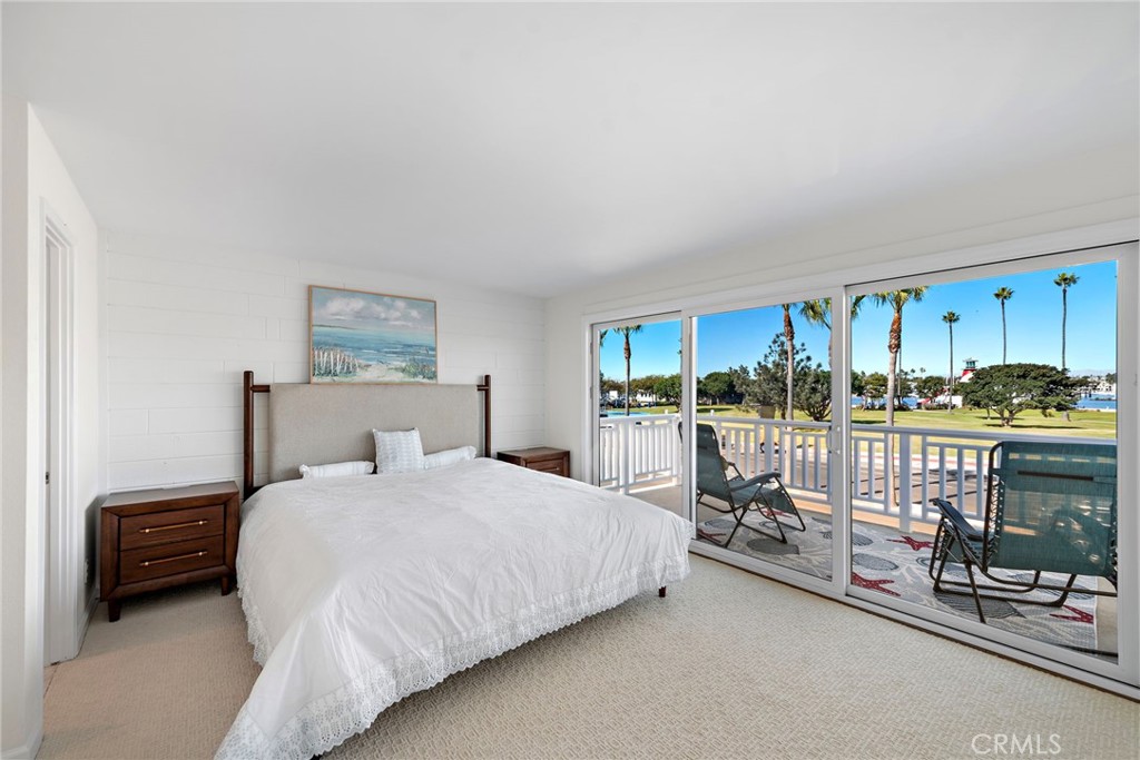 1707 West Balboa Boulevard, Unit A Newport Beach, CA 92663 - Photo 20 of 30 a bedroom with a bed a couch and dresser