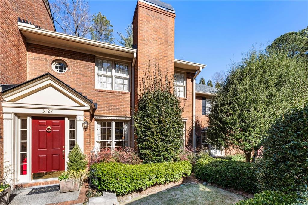 3127 Vinings Ridge Drive Southeast Atlanta, GA 30339 - Photo 1 of 33 a front view of a house with garden