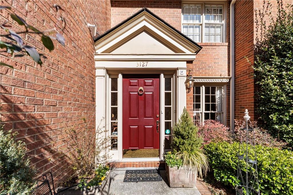 3127 Vinings Ridge Drive Southeast Atlanta, GA 30339 - Photo 13 of 33 a front view of a house with a garden
