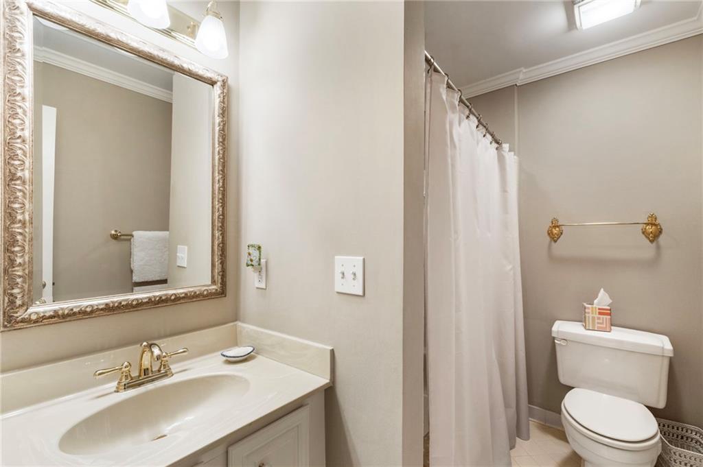 3127 Vinings Ridge Drive Southeast Atlanta, GA 30339 - Photo 25 of 33 a bathroom with a sink toilet and mirror