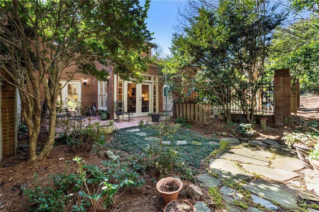 3127 Vinings Ridge Drive Southeast Atlanta, GA 30339 - Photo 27 of 33 a view of a house with backyard and garden