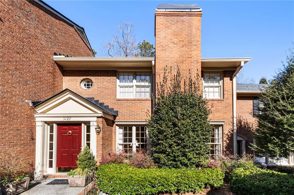 3127 Vinings Ridge Drive Southeast Atlanta, GA 30339 - Photo 28 of 33 a front view of a house with garden
