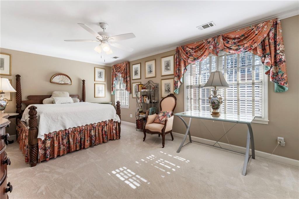 3127 Vinings Ridge Drive Southeast Atlanta, GA 30339 - Photo 10 of 33 a bedroom with a bed couch and a window