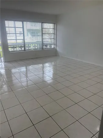 a view of empty room with windows