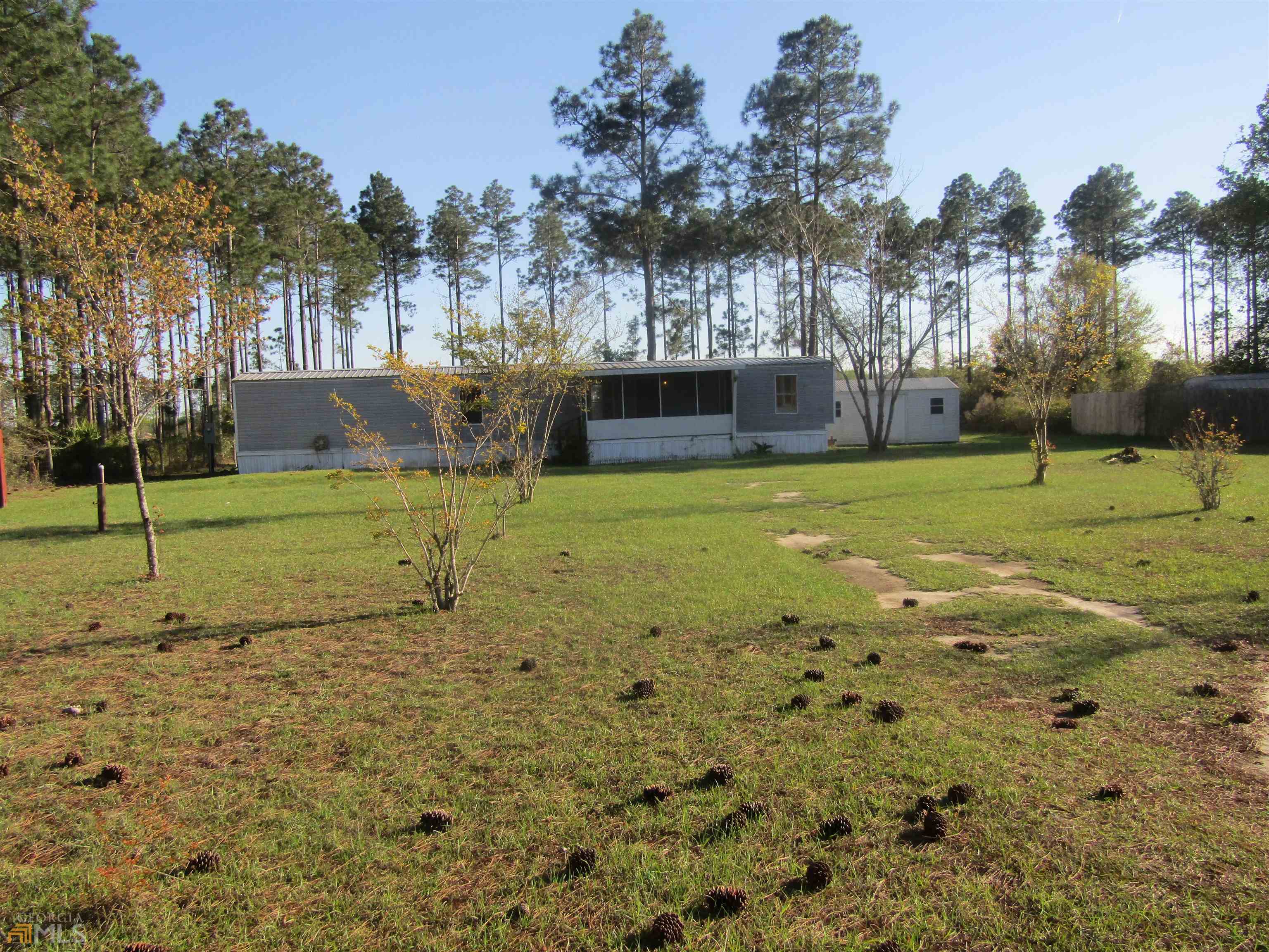 239 Aaron Holland Road Jesup, GA 31545 - Photo 1 of 1 a view of a playground with large trees