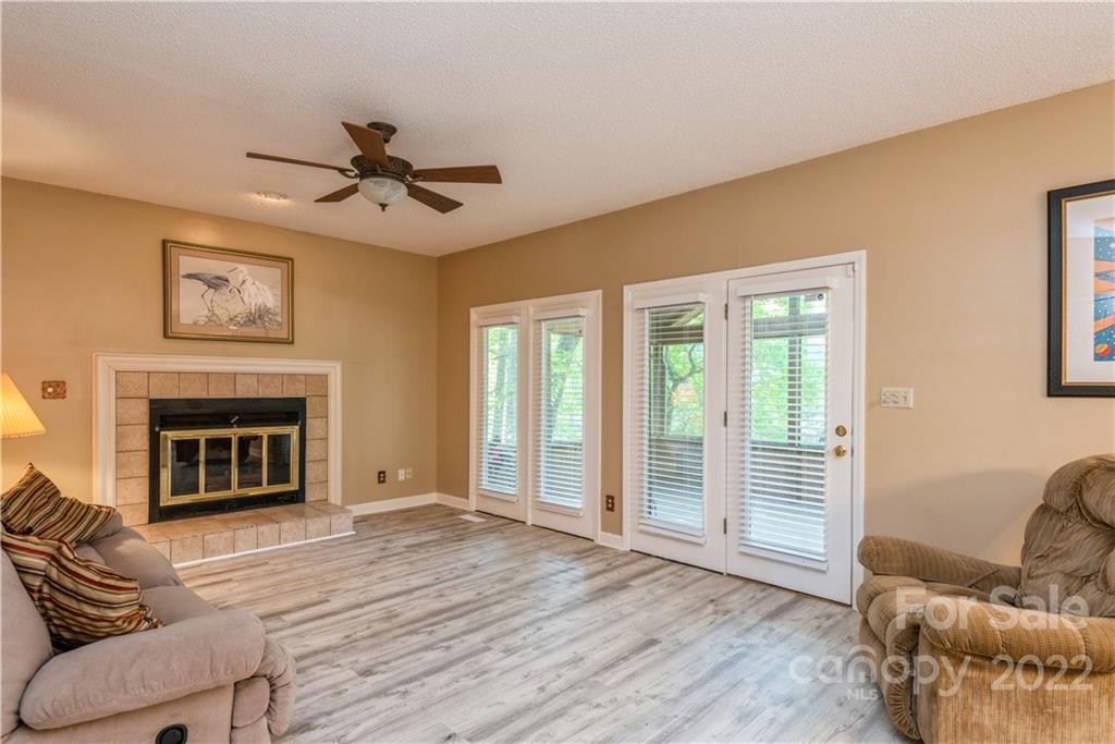 26050 Neptunes Landing Tega Cay, SC 29708 - Photo 13 of 39 a living room with furniture and a fireplace