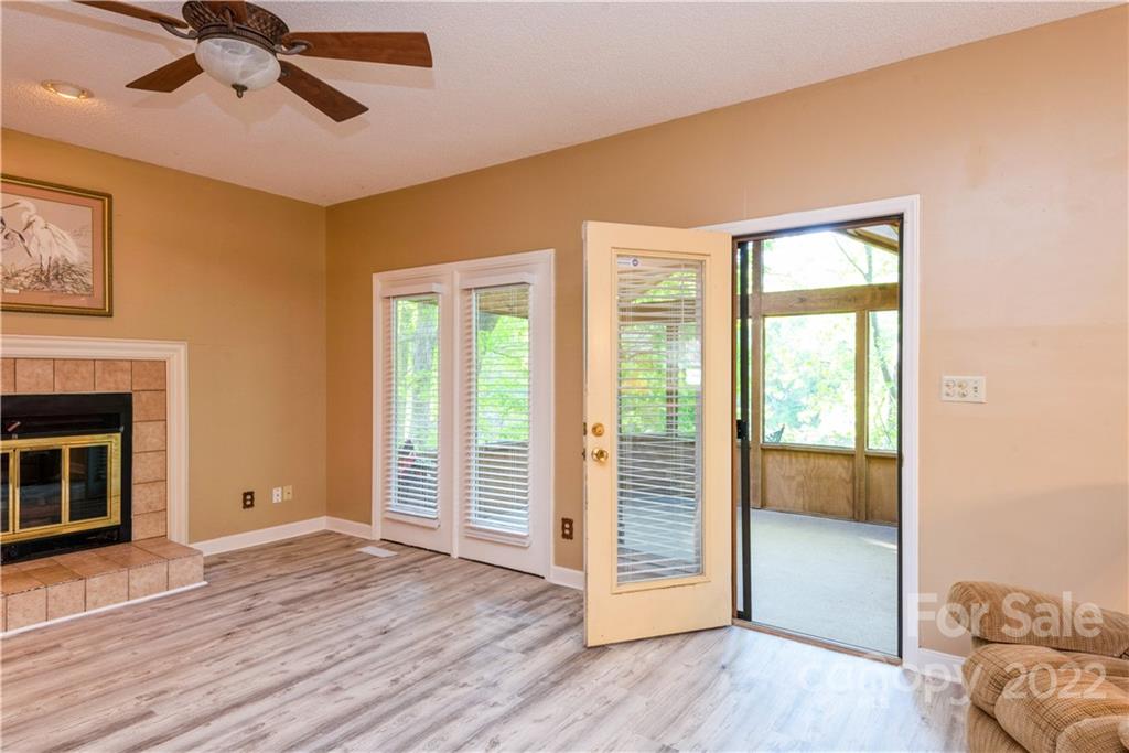 26050 Neptunes Landing Tega Cay, SC 29708 - Photo 15 of 39 a view of livingroom with hardwood floor and ceiling fan