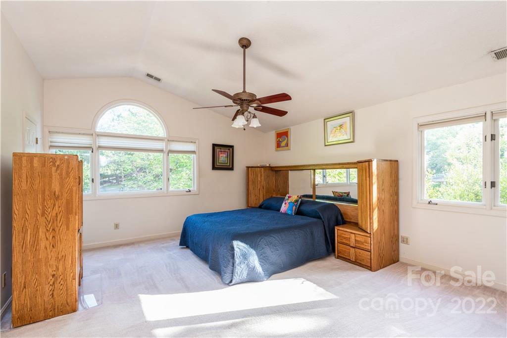 26050 Neptunes Landing Tega Cay, SC 29708 - Photo 22 of 39 a living room with furniture and a large window