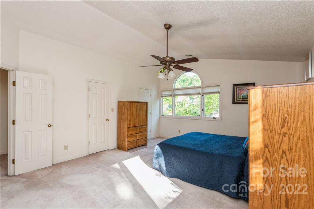 26050 Neptunes Landing Tega Cay, SC 29708 - Photo 23 of 39 a living room with a bed furniture and a window
