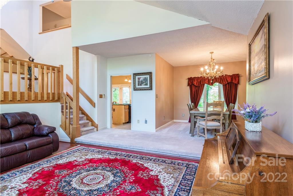 26050 Neptunes Landing Tega Cay, SC 29708 - Photo 6 of 39 a living room with furniture and wooden floor