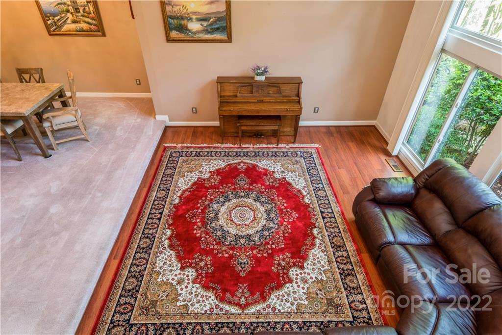 26050 Neptunes Landing Tega Cay, SC 29708 - Photo 7 of 39 a living room with furniture and a rug