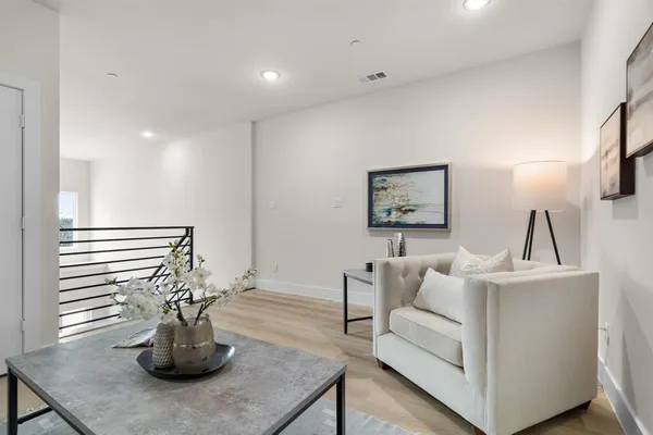 a living room with furniture and a table