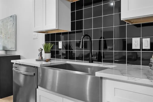 a kitchen with a sink and cabinets