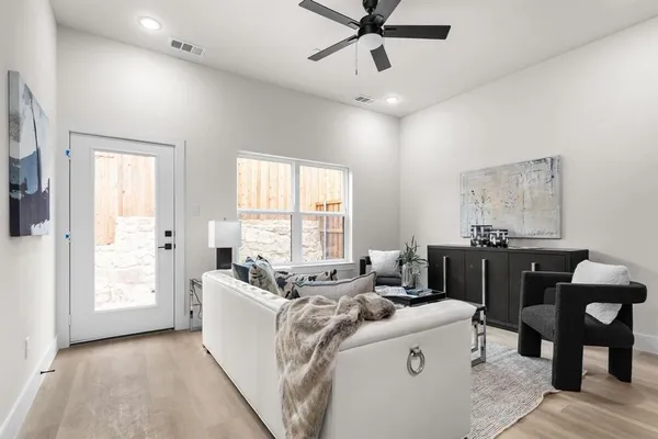 a living room with furniture and a window