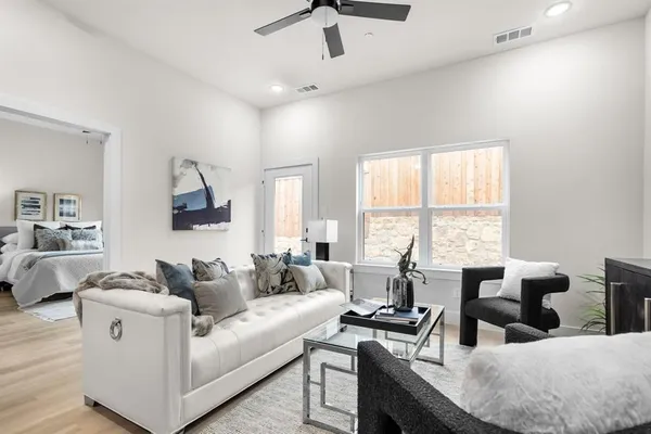 a living room with furniture and a large window