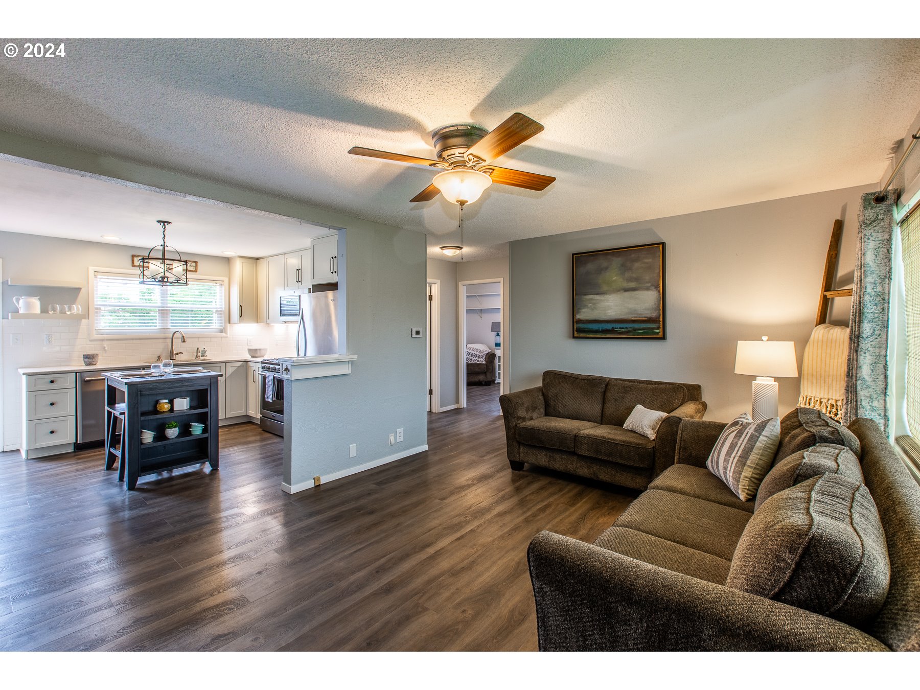 1429 L Street Springfield, OR 97477 - Photo 3 of 20 a living room with furniture and wooden floor