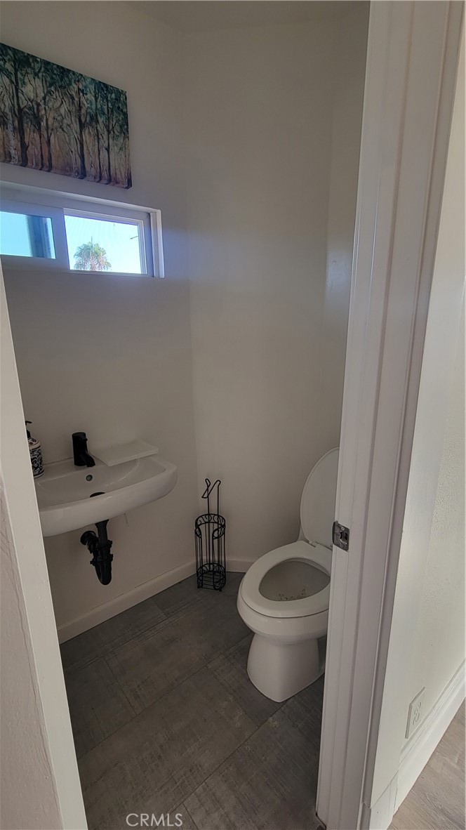 503 West Colton Avenue Redlands, CA 92374 - Photo 17 of 18 a bathroom with a toilet and a sink