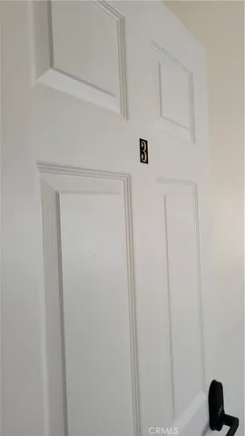 a view of an empty room and a window