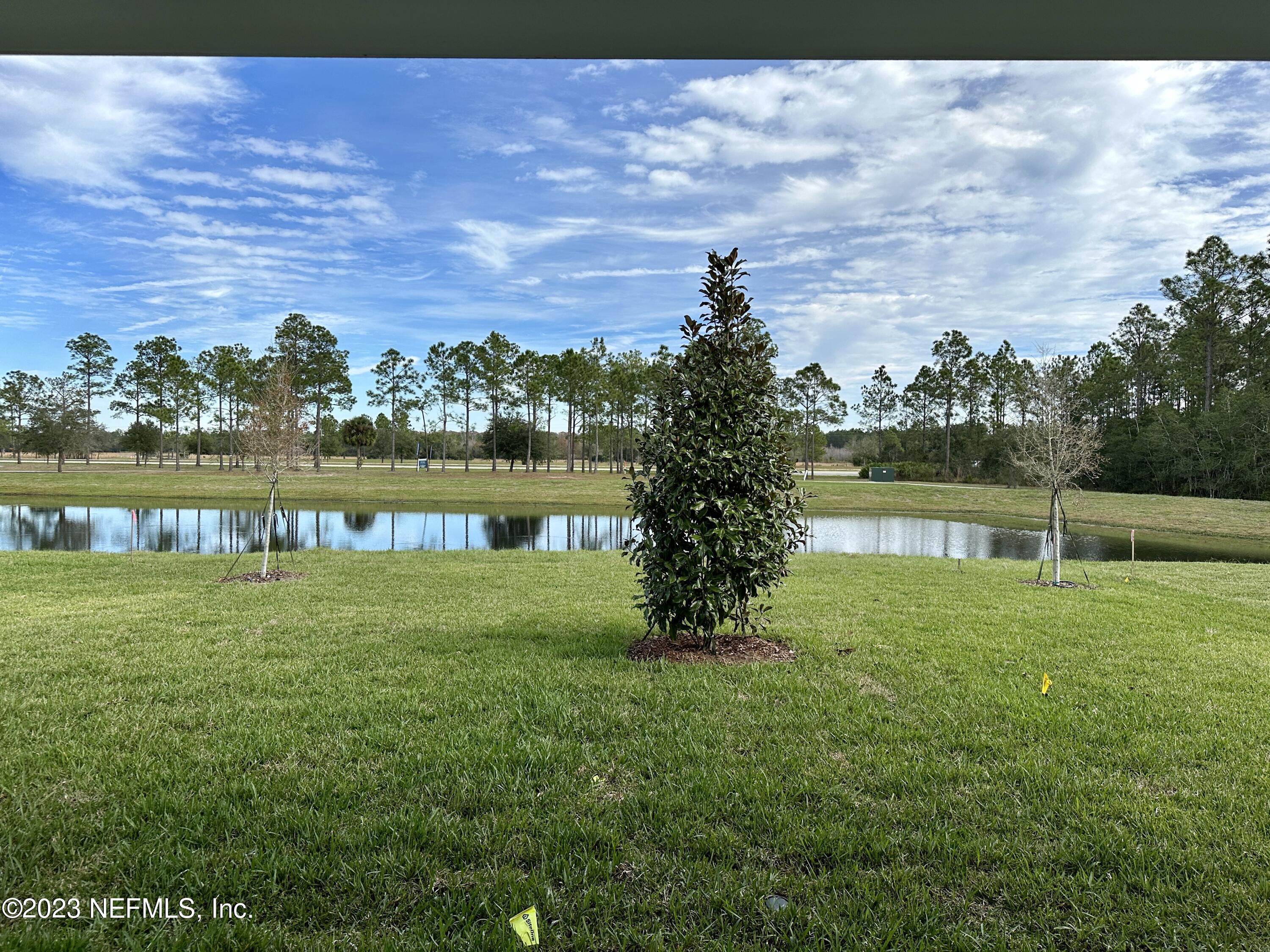 9 Jackson Blue Place Palm Coast, FL 32137 - Photo 13 of 21 a view of a garden with a lake