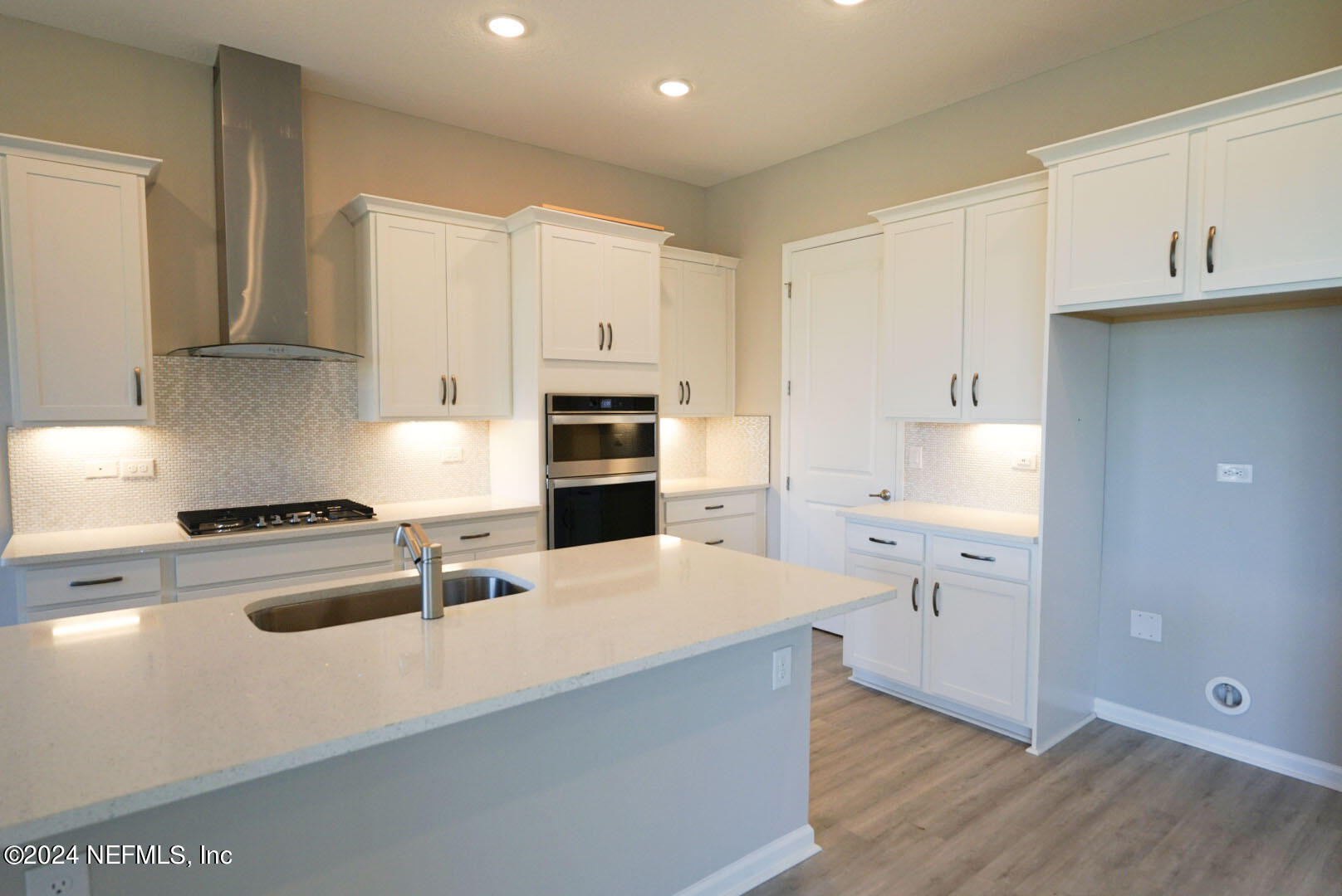 9 Jackson Blue Place Palm Coast, FL 32137 - Photo 4 of 21 a kitchen with stainless steel appliances a refrigerator sink and stove