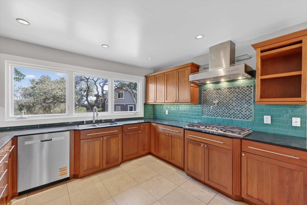 505 Hidden Valley Road Watsonville, CA 95076 - Photo 15 of 72 a kitchen with stainless steel appliances granite countertop a sink and cabinets
