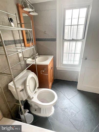 1344 Ellsworth Street, Unit 2F Philadelphia, PA 19147 - Photo 5 of 8 a bathroom with a toilet a sink and a window