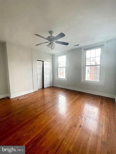1344 Ellsworth Street, Unit 2F Philadelphia, PA 19147 - Photo 6 of 8 a view of an empty room with wooden floor and a window