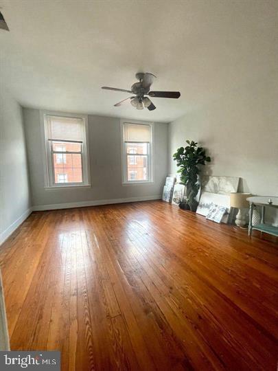 1344 Ellsworth Street, Unit 2F Philadelphia, PA 19147 - Photo 7 of 8 wooden floor in an empty room with a window
