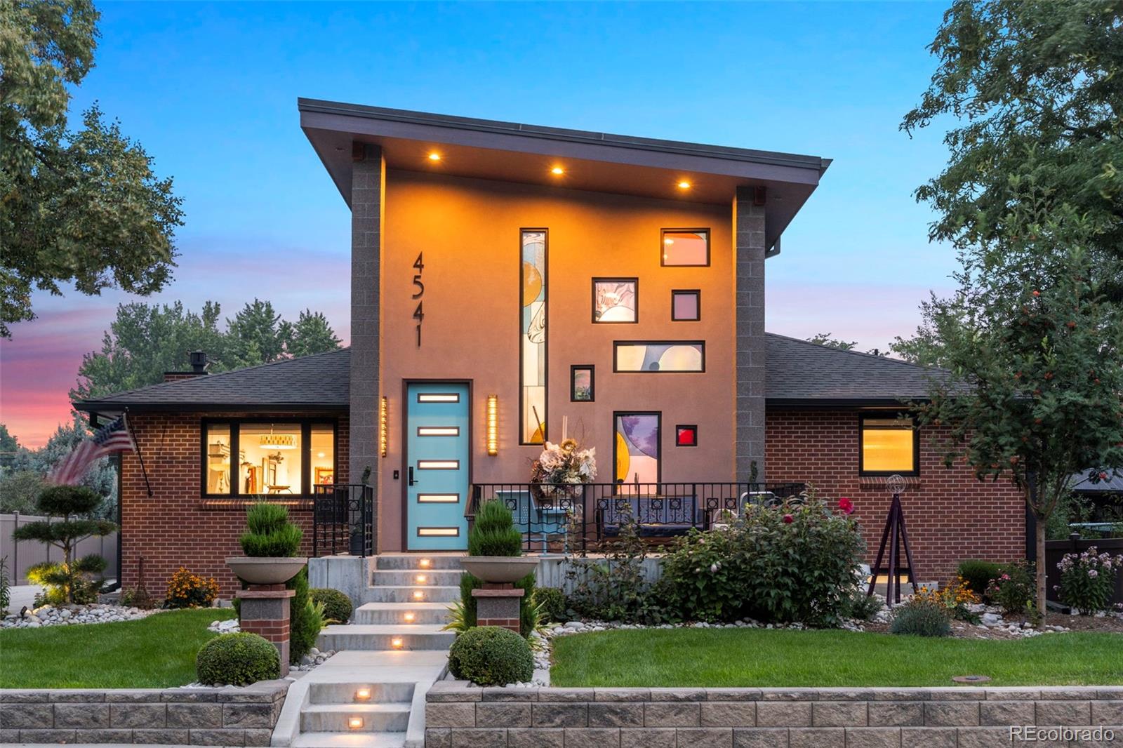 4541 Reed Street Wheat Ridge, CO 80033 - Photo 1 of 43 a front view of a house with a yard