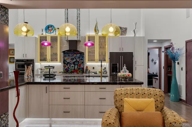 a kitchen with counter top space cabinets and appliances