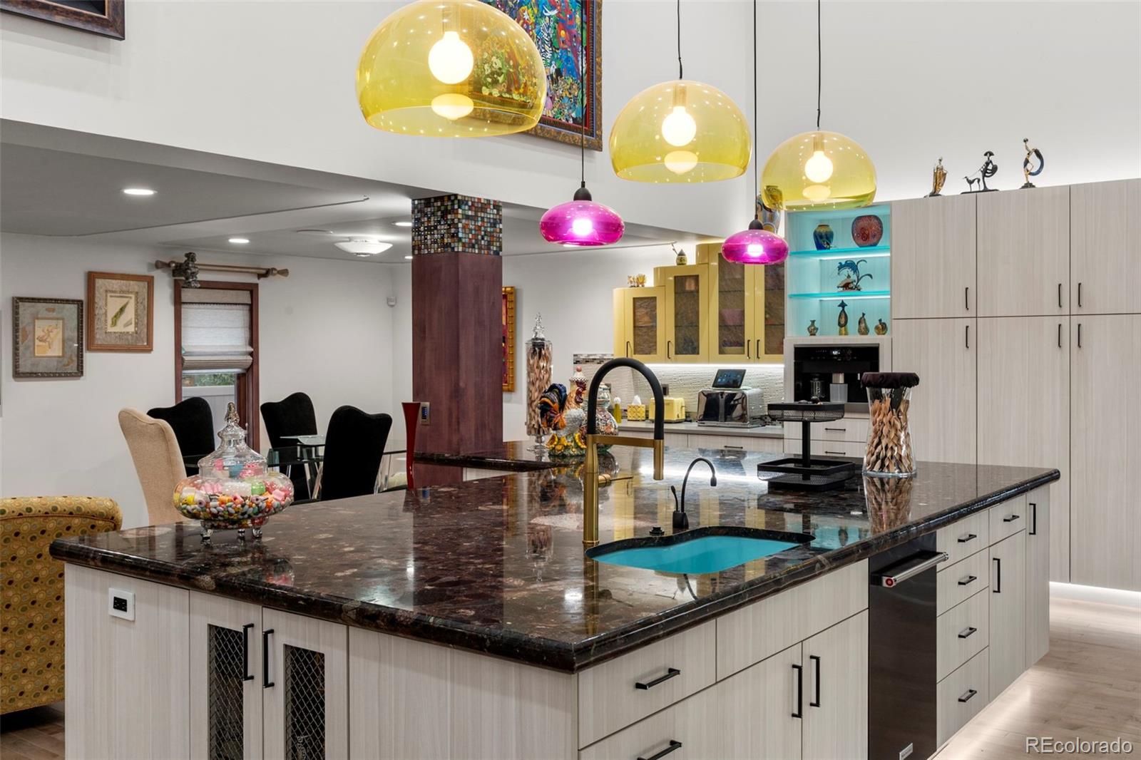 4541 Reed Street Wheat Ridge, CO 80033 - Photo 15 of 43 a kitchen with granite countertop a sink cabinets and window