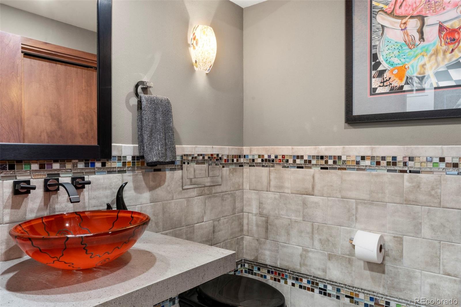 4541 Reed Street Wheat Ridge, CO 80033 - Photo 22 of 43 a bathroom with a sink and a mirror