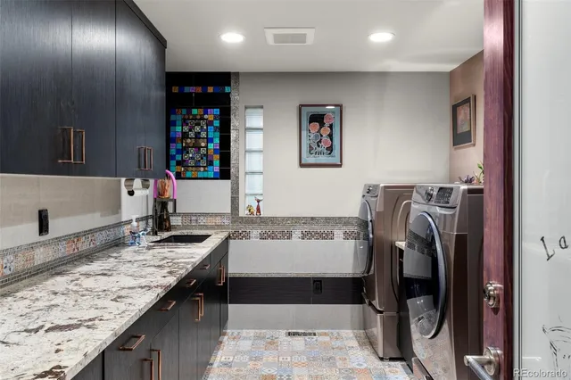 a view of a kitchen with a sink and cabinets