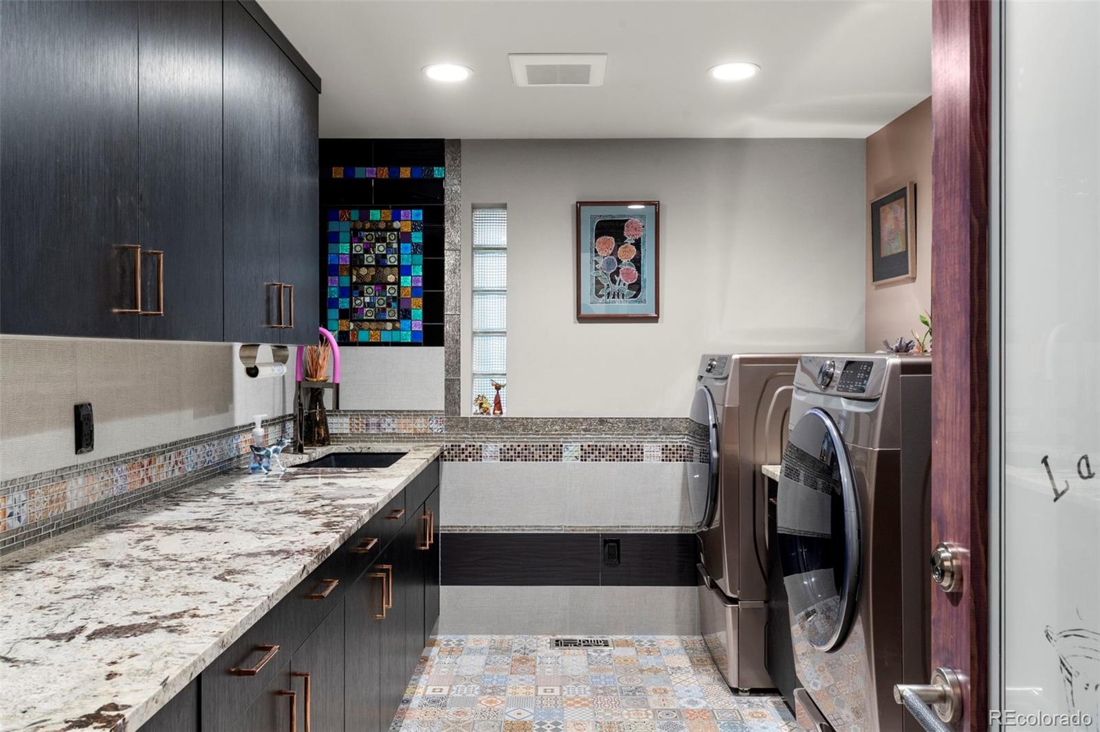 4541 Reed Street Wheat Ridge, CO 80033 - Photo 28 of 43 a view of a kitchen with a sink and dishwasher