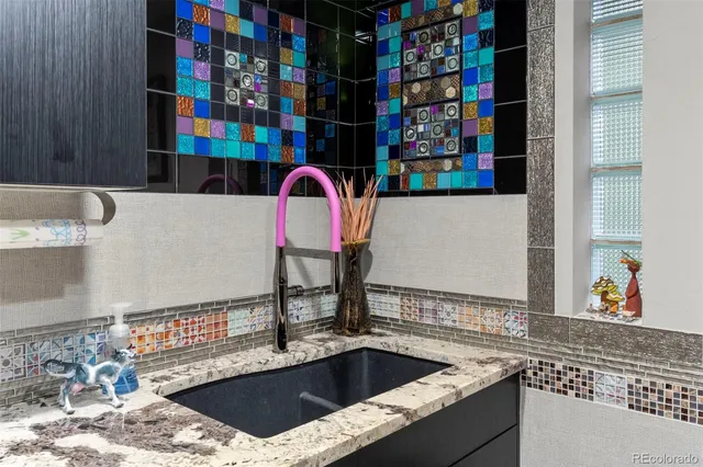 a dining room with furniture a window and a flat screen tv