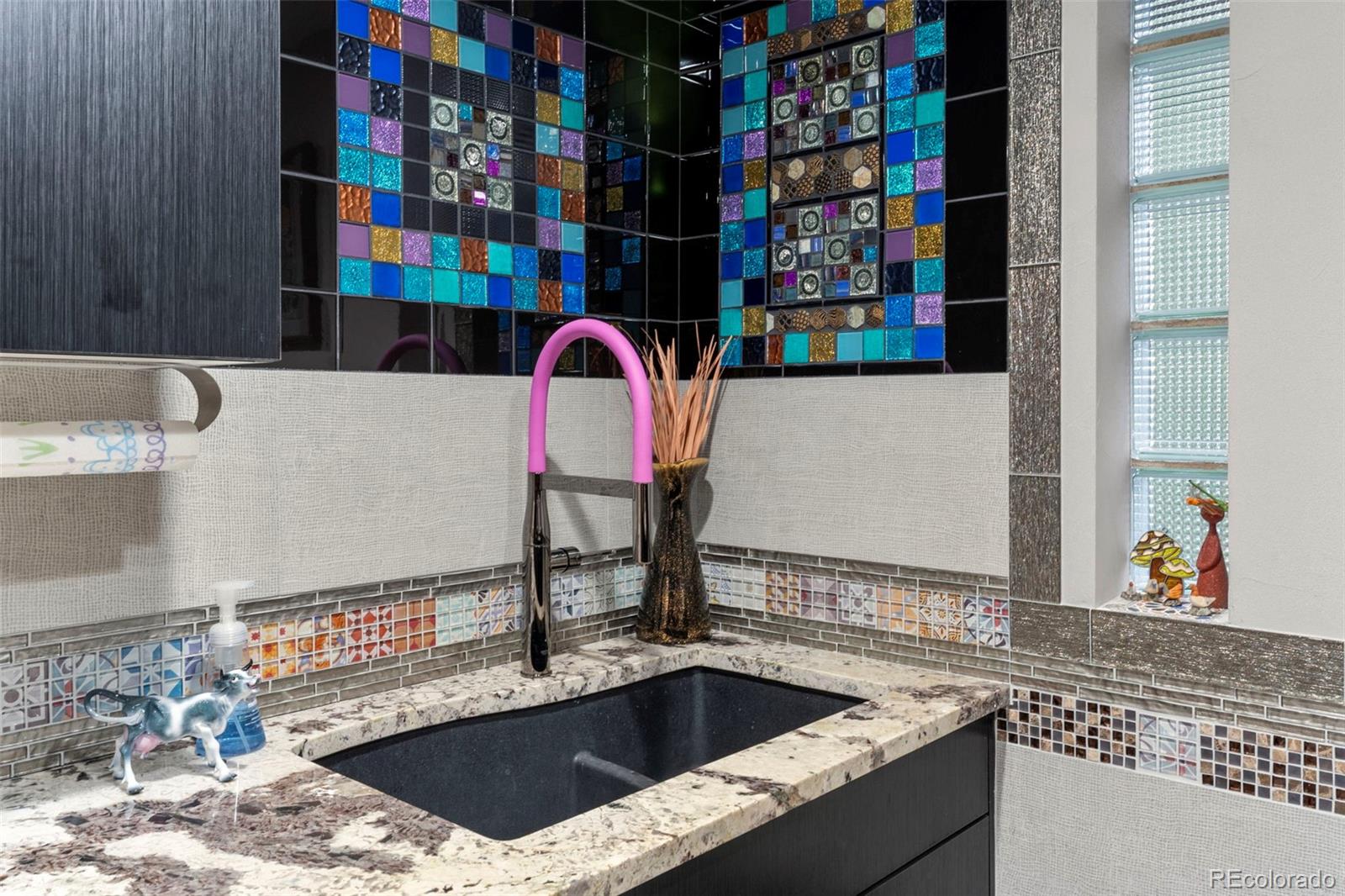 4541 Reed Street Wheat Ridge, CO 80033 - Photo 29 of 43 a view of a kitchen with a sink and cabinets