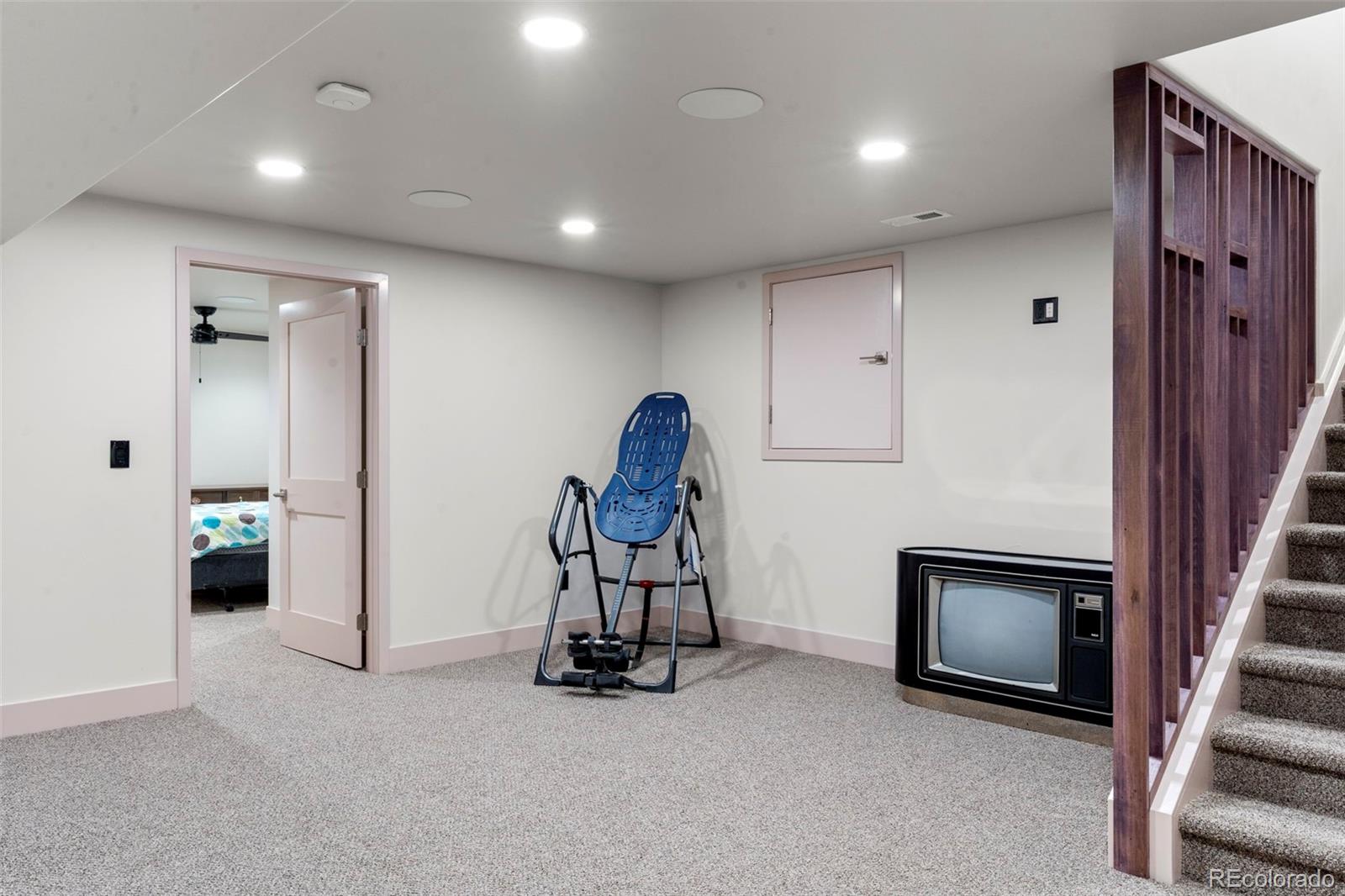 4541 Reed Street Wheat Ridge, CO 80033 - Photo 34 of 43 a view of a room with gym equipment