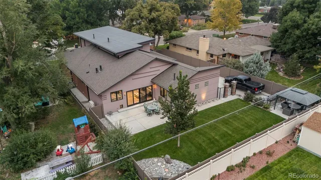 an aerial view of a house with a yard
