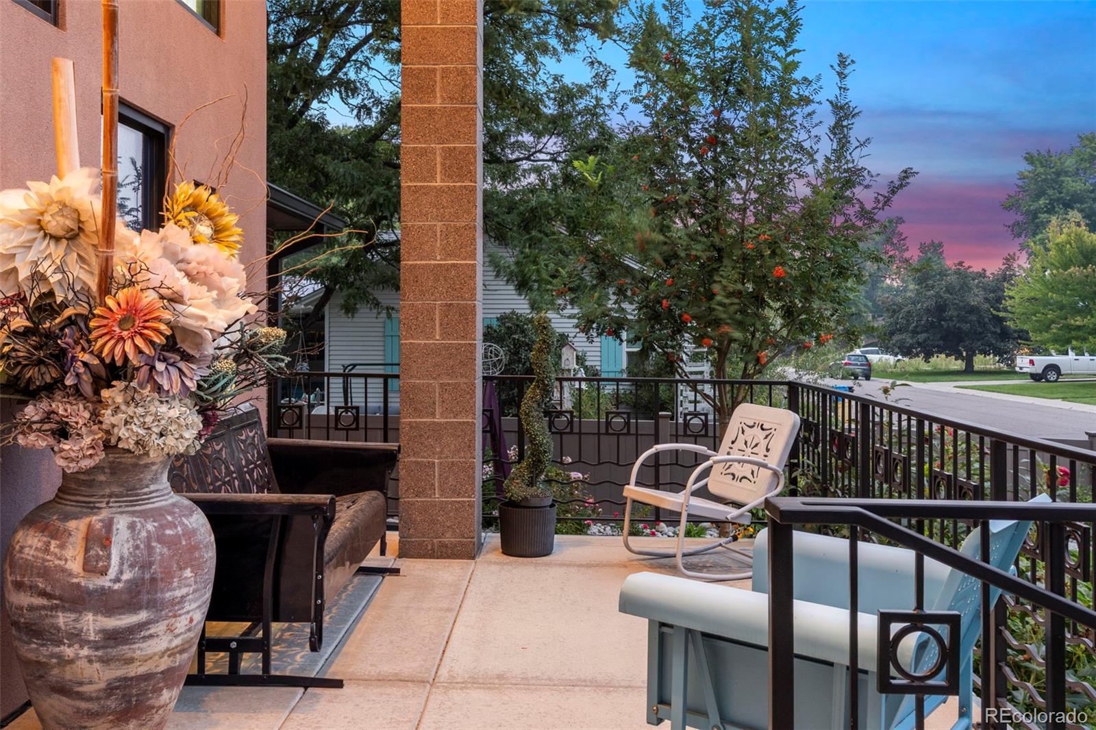 4541 Reed Street Wheat Ridge, CO 80033 - Photo 5 of 43 a view of a chairs and table in the balcony