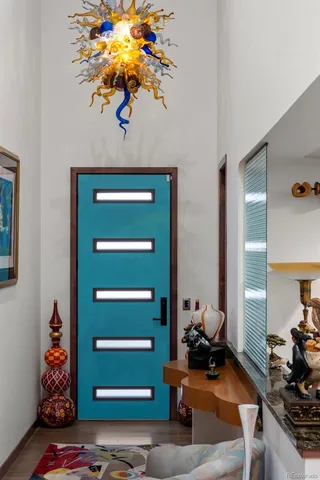 a room with furniture and a potted plant