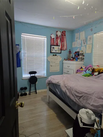 a bathroom with a toilet and a bath tub