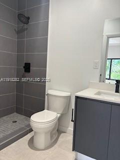 85 Northeast 55th Street, Unit 5 Miami, FL 33137 - Photo 8 of 14 a bathroom with a sink a toilet and a mirror