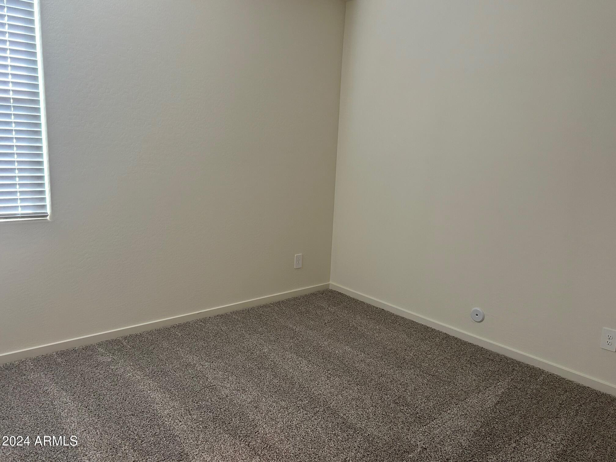 20520 North Candlelight Road Maricopa, AZ 85138 - Photo 9 of 18 an empty room with a empty space