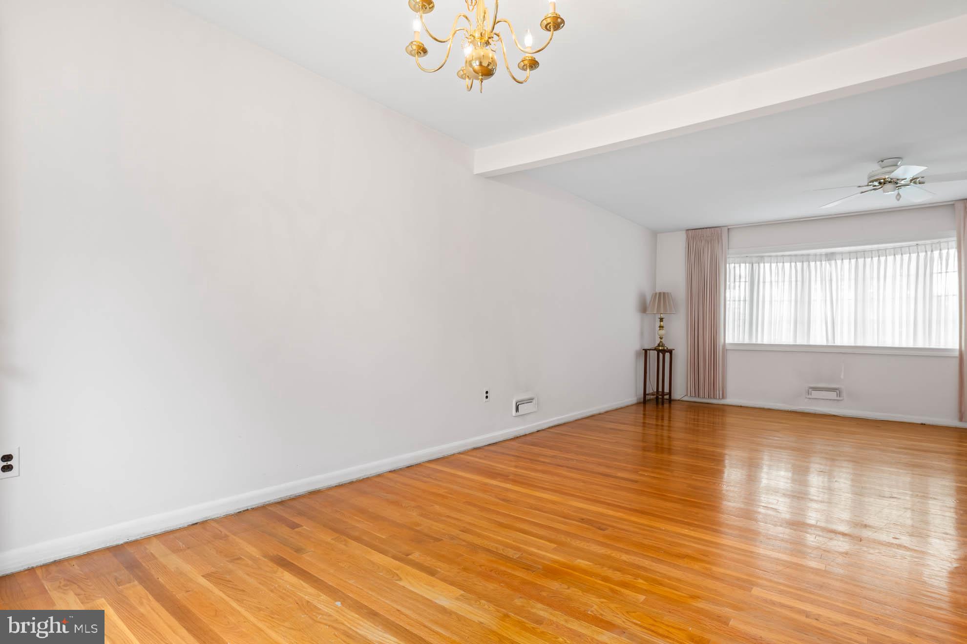 210 Rothwell Drive Lutherville-Timonium, MD 21093 - Photo 13 of 48 wooden floor in an empty room with a window