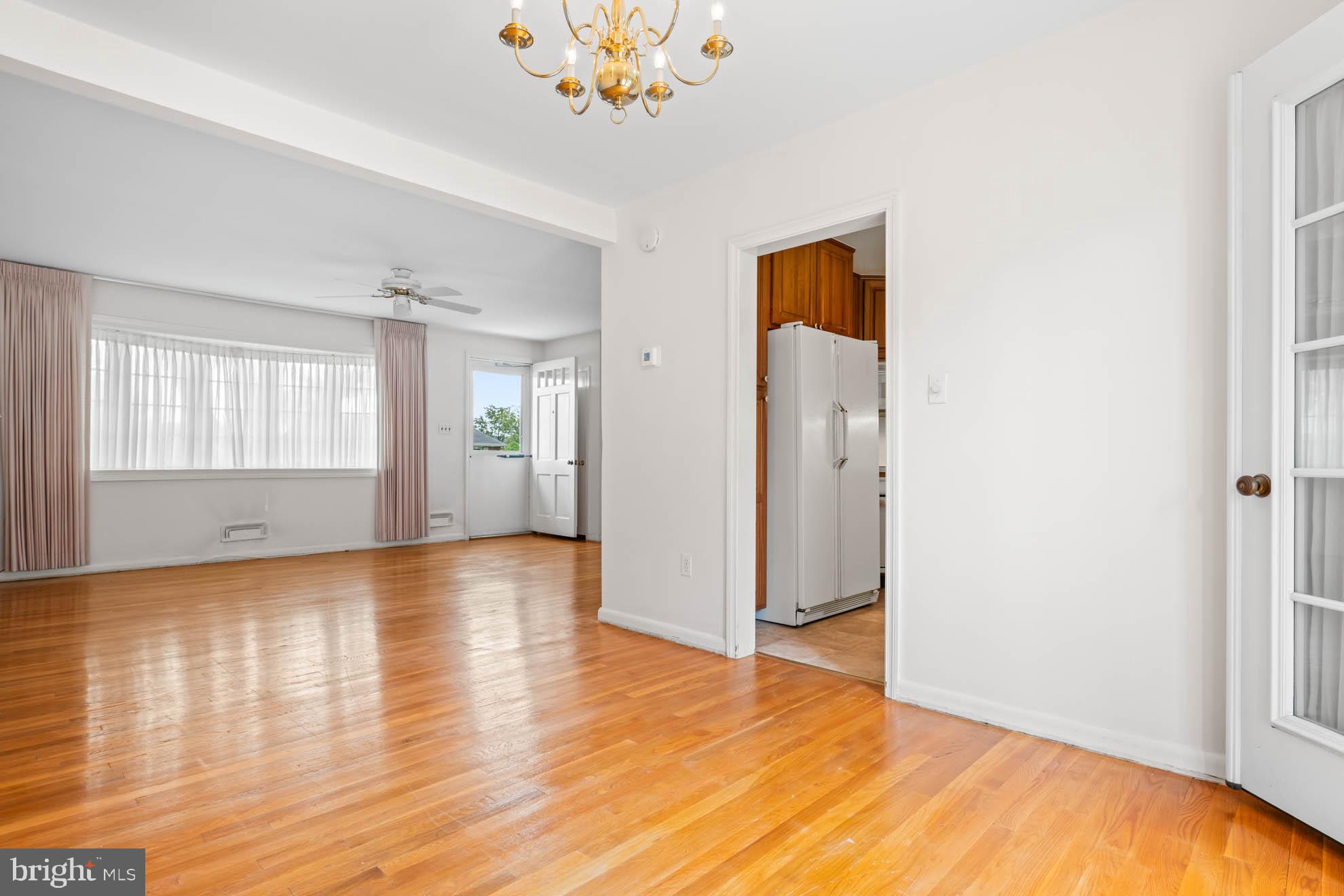 210 Rothwell Drive Lutherville-Timonium, MD 21093 - Photo 14 of 48 an empty room with wooden floor and windows