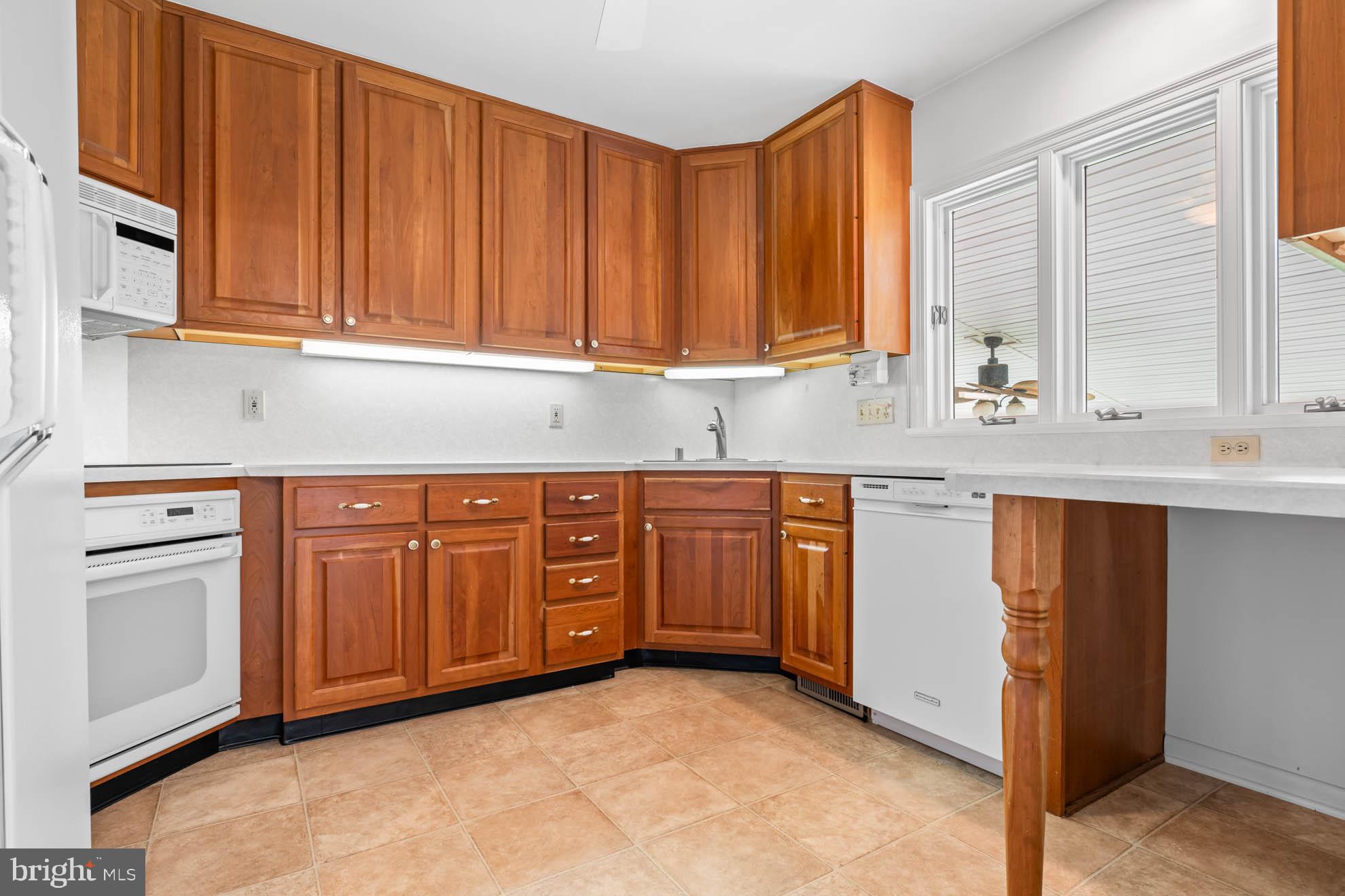 210 Rothwell Drive Lutherville-Timonium, MD 21093 - Photo 15 of 48 a kitchen with stainless steel appliances granite countertop a sink dishwasher stove and cabinets