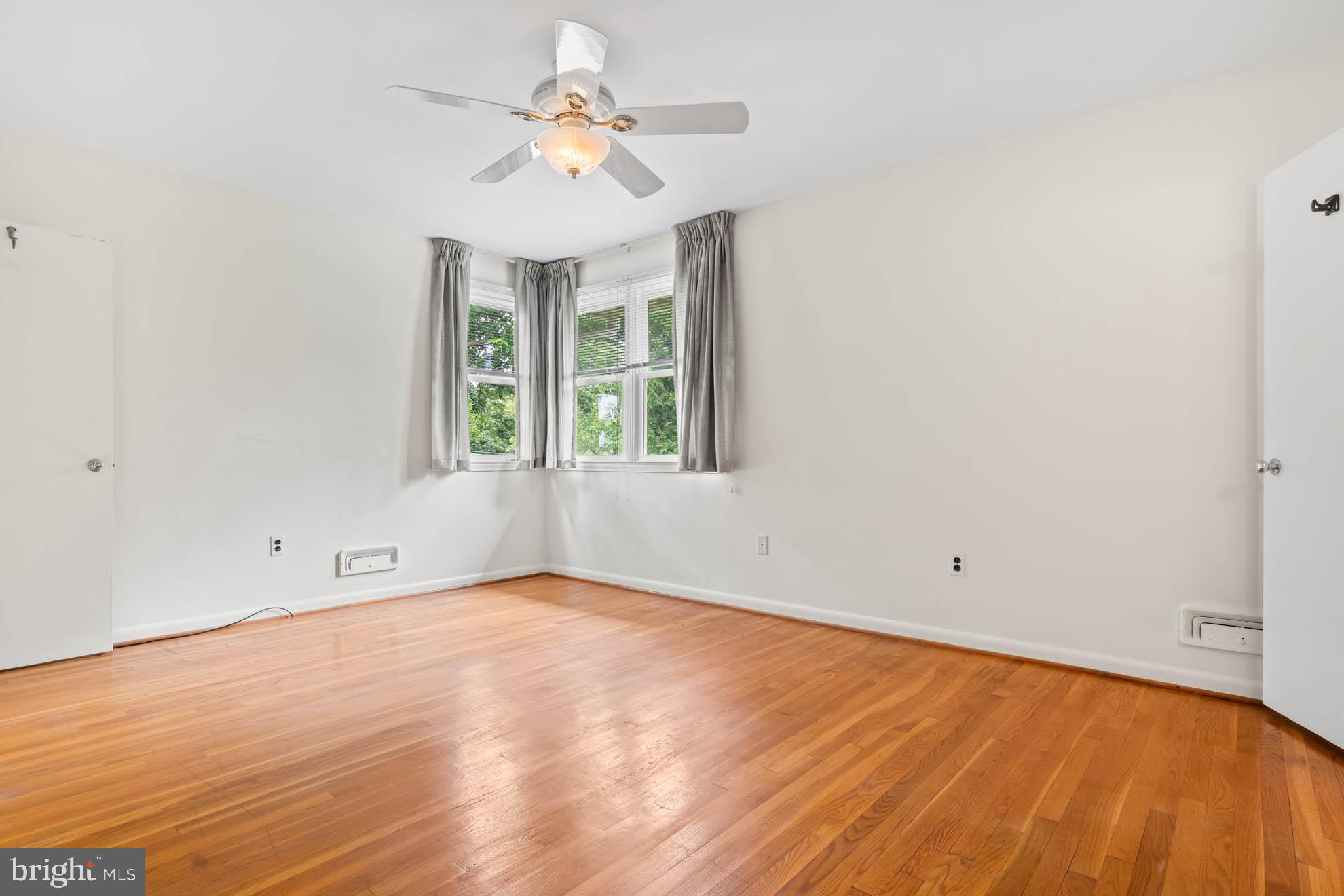 210 Rothwell Drive Lutherville-Timonium, MD 21093 - Photo 17 of 48 wooden floor in an empty room with a window