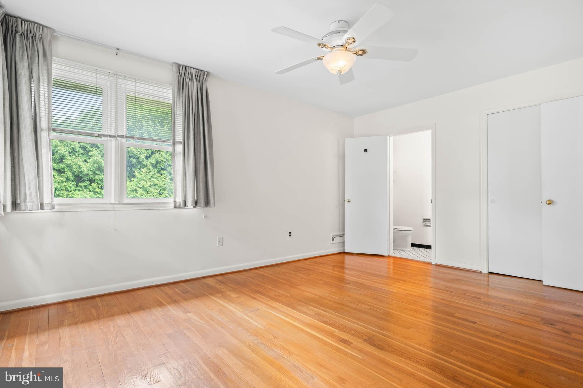 210 Rothwell Drive Lutherville-Timonium, MD 21093 - Photo 18 of 48 wooden floor in an empty room with a window